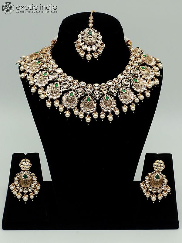 exotic india Designer Necklace Set With Hanging Beads Mangtika And Brass Carving Earrings 