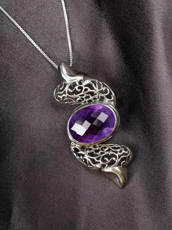 Exotic India Designer Sterling Silver Pendant With Faceted Oval Shape Gemstone