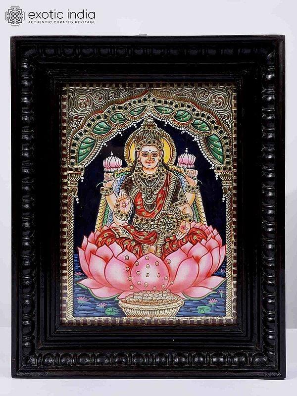 exotic india Devi Lakshmi Seated on Lotus Framed Tanjore Painting | 24 Karat Gold Work 