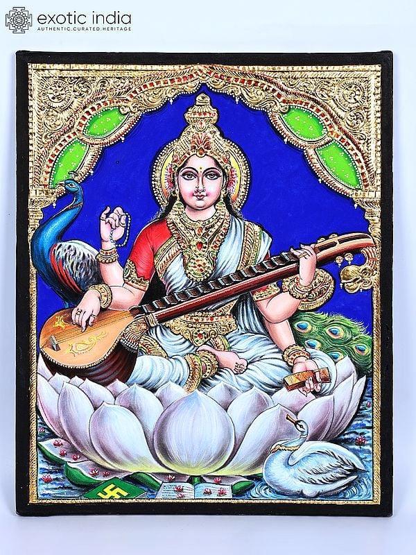 exotic india Devi Saraswati Seated on Shwet Kamal | 24 Karat Gold Work | Tanjore Painting 