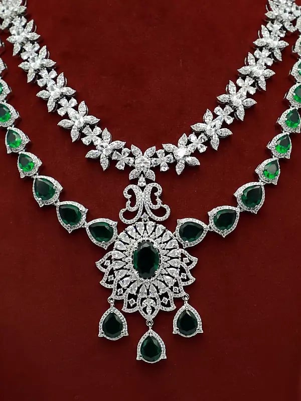 Exotic India Double Layered Floral Design Stone Studded American Diamond Necklace Set With Earrings 