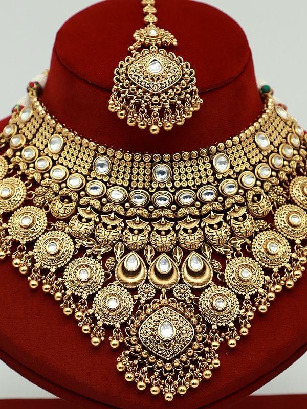 Exotic India Embellished Carving Necklace Set With Attractive Mangtika And Earrings