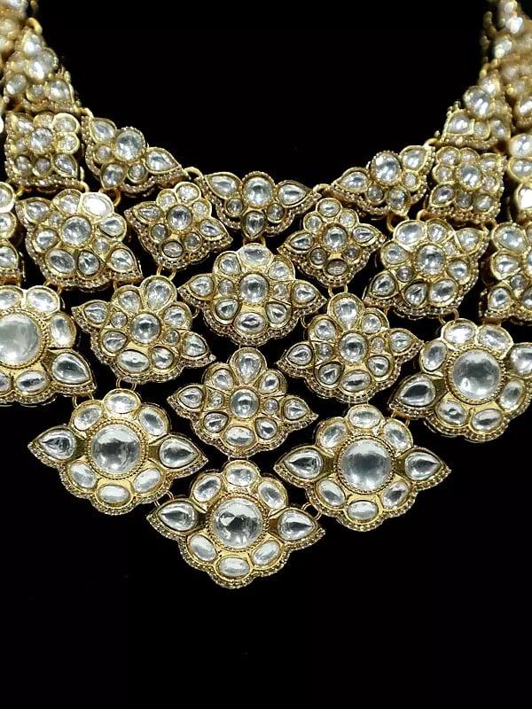 Exotic India Embellished Designer Stone Studded Copper And Kundan Necklace Set With Earrings