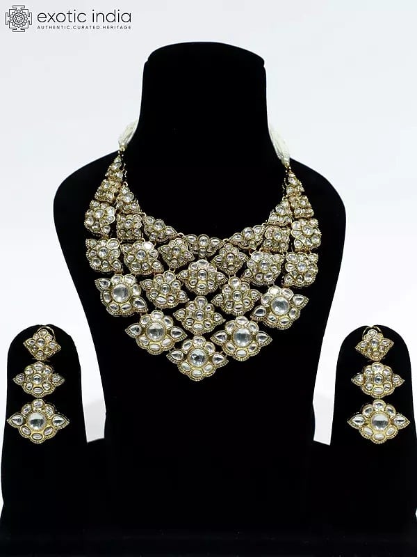 exotic india Embellished Designer Stone Studded Copper And Kundan Necklace Set With Earrings 