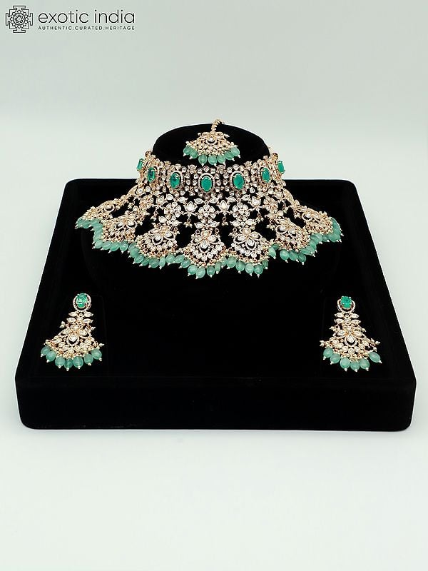 exotic india Embellished Floral Design Stone Studded And Beaded Choker Necklace With Earrings And Mangtika
