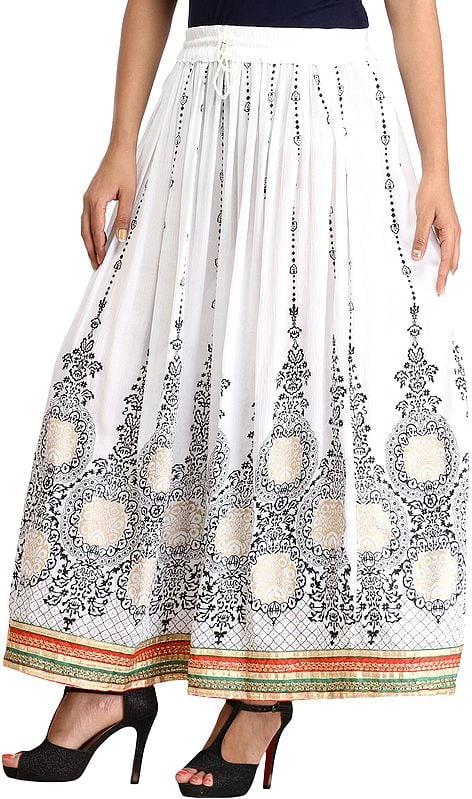 Exotic India Embellished Long Skirt With Golden Print And Embroidered Patch Border 