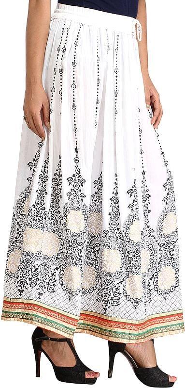 Exotic India Embellished Long Skirt With Golden Print And Embroidered Patch Border 