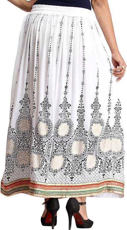 Exotic India Embellished Long Skirt With Golden Print And Embroidered Patch Border 