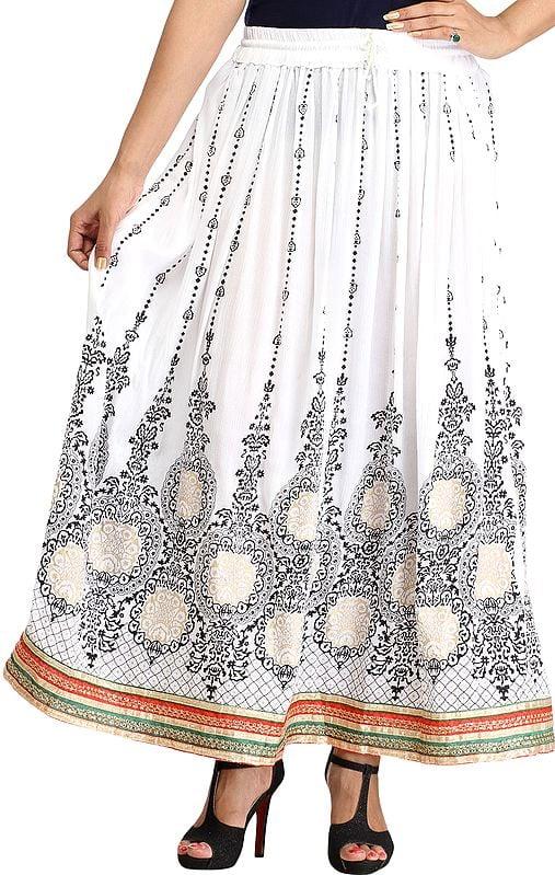 exotic india Embellished Long Skirt with Golden Print and Embroidered Patch Border 