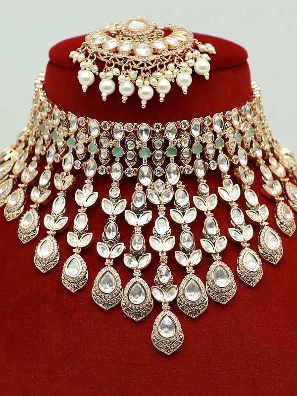 Exotic India Embellished Moissanite Kundan With Matt Polish Choker Necklace With Earrings And Mangtika
