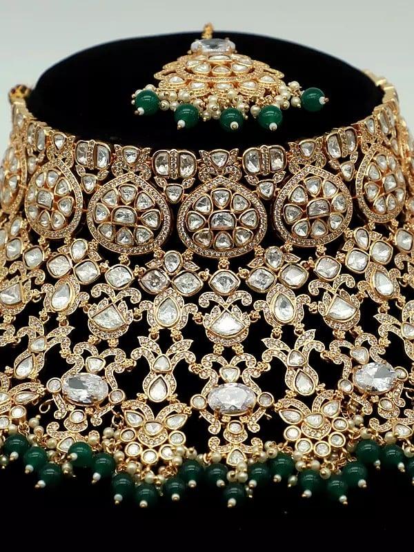 Exotic India Embellished Stone Studded And Beaded Choker Necklace With Earrings And Mangtika 
