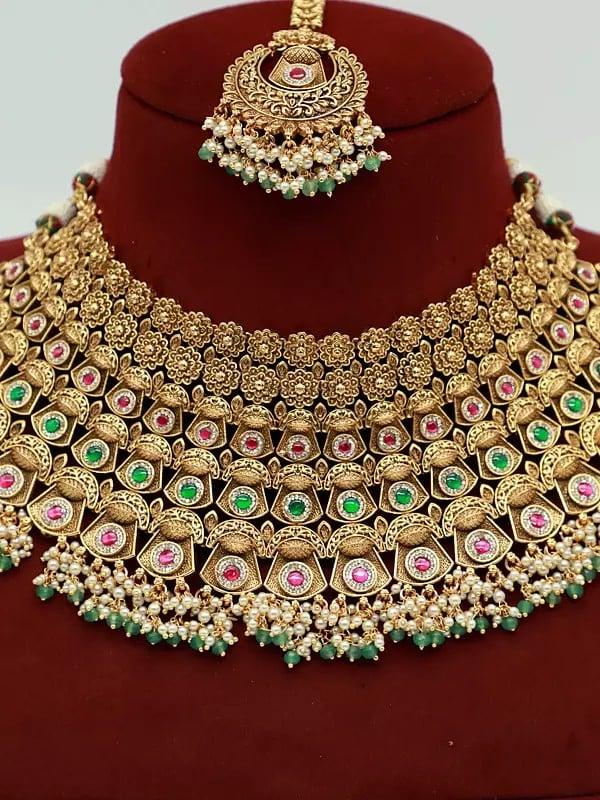 Exotic India Embellished Stone Studded And Beaded Stunning Necklace With Earrings And Mangtika