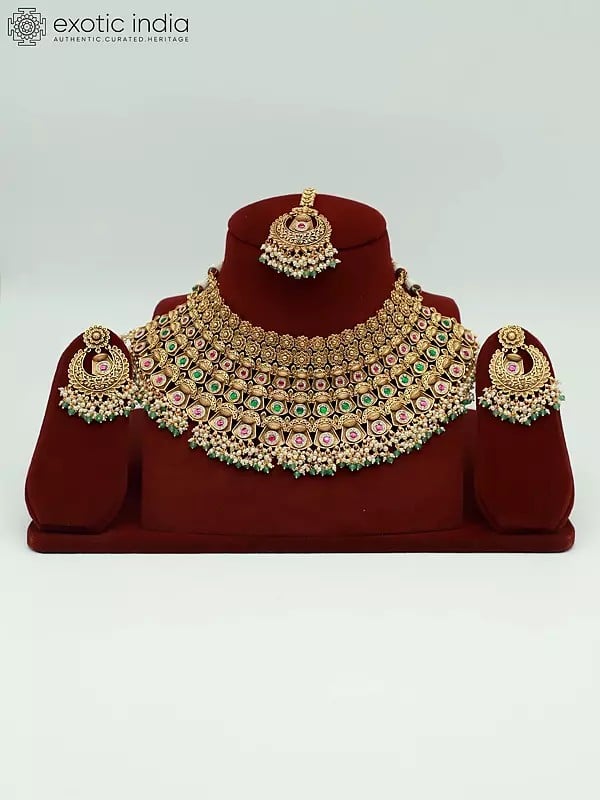 exotic india Embellished Stone Studded And Beaded Stunning Necklace With Earrings And Mangtika 