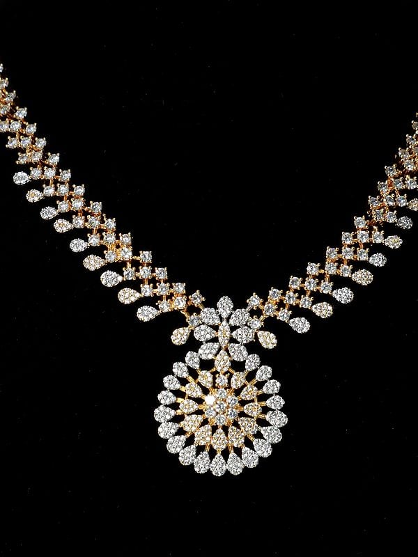 Exotic India Embellished Stone Studded Floral Design American Diamond Necklace Set With Earrings