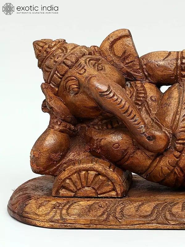 Exotic India 14" Relaxing Ganesha Statue In Wood 