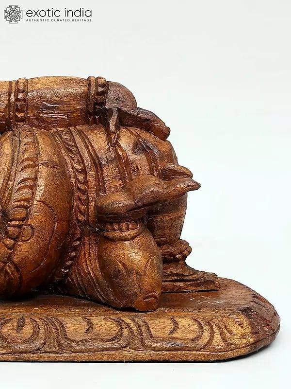 Exotic India 14" Relaxing Ganesha Statue In Wood 