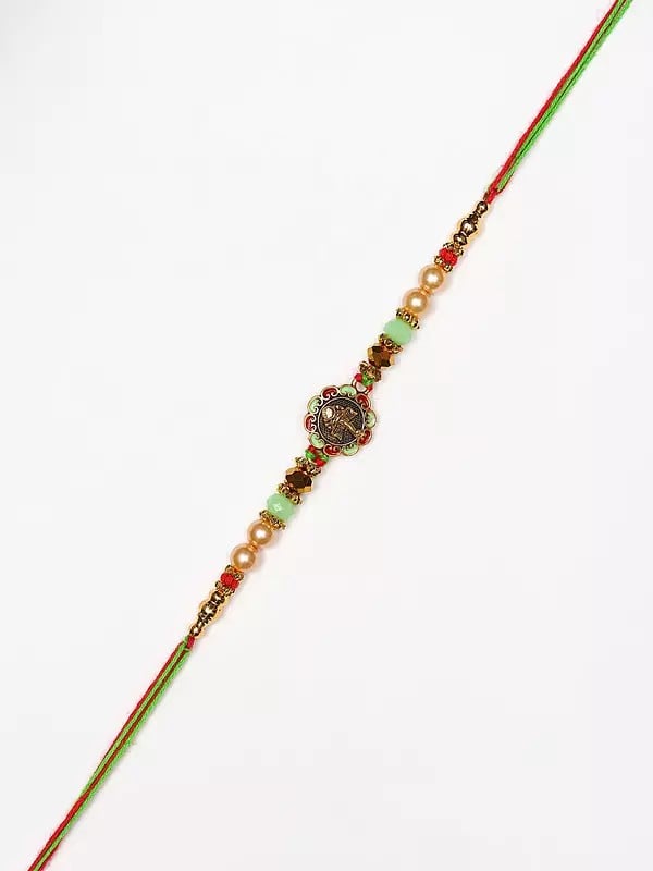 Exotic India Beaded Lord Ganesha Face Rakhi 