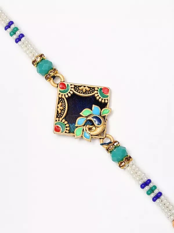 Exotic India Enamel Work Peacock Rakhi With Beads 