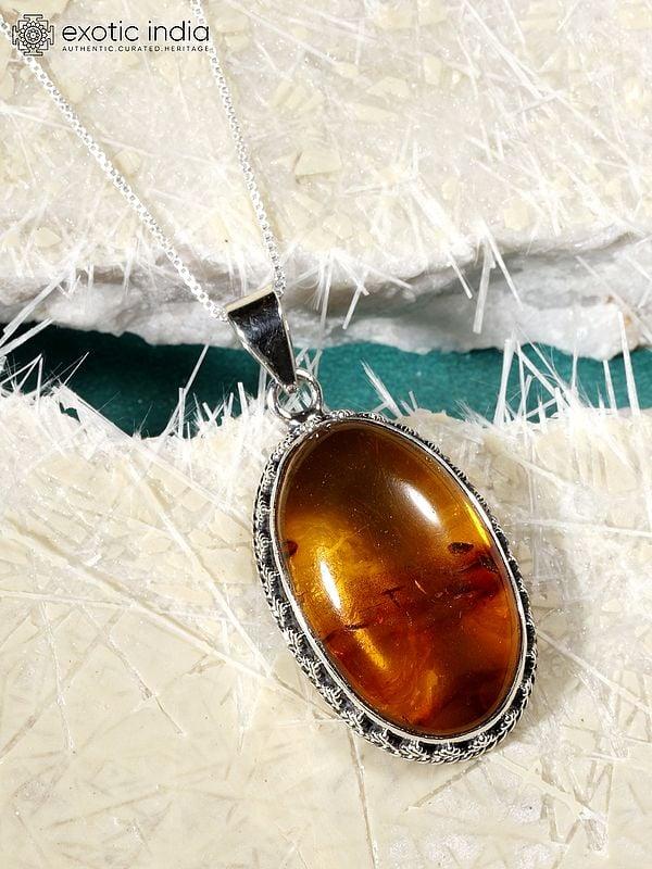 Exotic India Oval Shape Amber Gemstone Pendant
