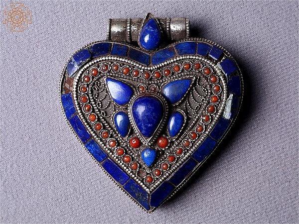 exotic india Silver Heart Decorated Ghau Pendant