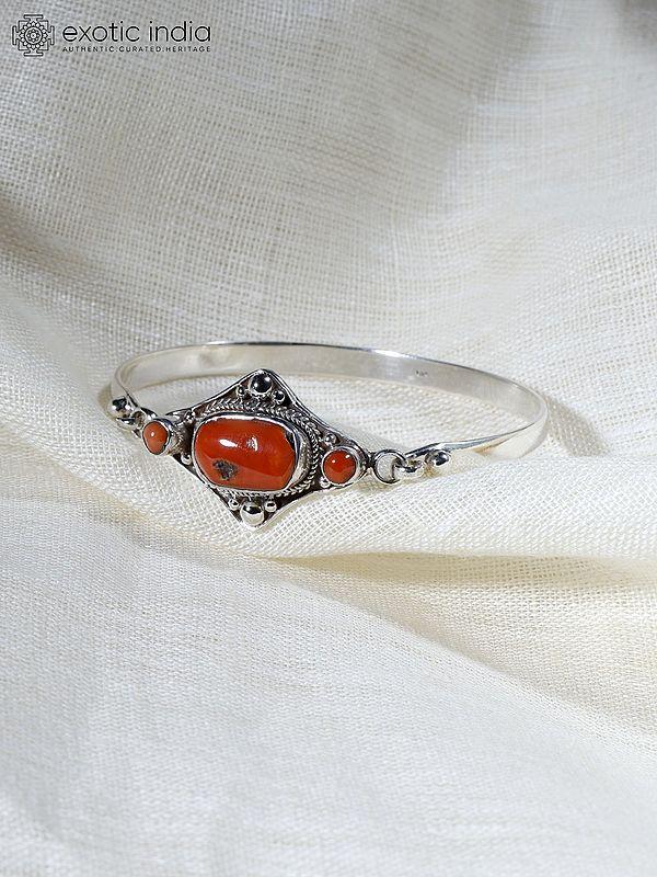 Exotic India Sterling Silver Bangle With Coral 