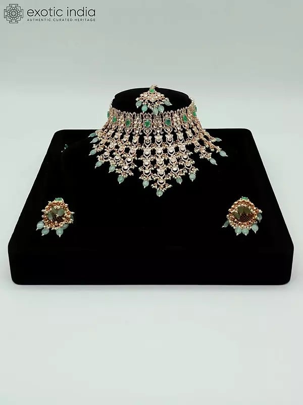exotic india Exquisite Floral Design Stone Studded And Beaded Choker Necklace With Earrings And Mangtika