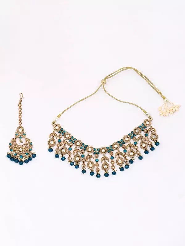 Exotic India Floral Design Dark Teal Stone Studded Necklace Set With Earrings And Mangtika