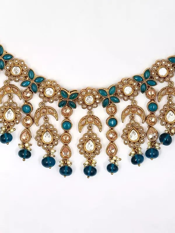 Exotic India Floral Design Dark Teal Stone Studded Necklace Set With Earrings And Mangtika
