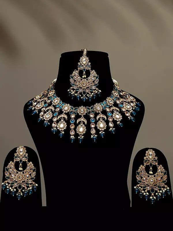 exotic india Floral Design Dark Teal Stone Studded Necklace Set with Earrings and Mangtika 