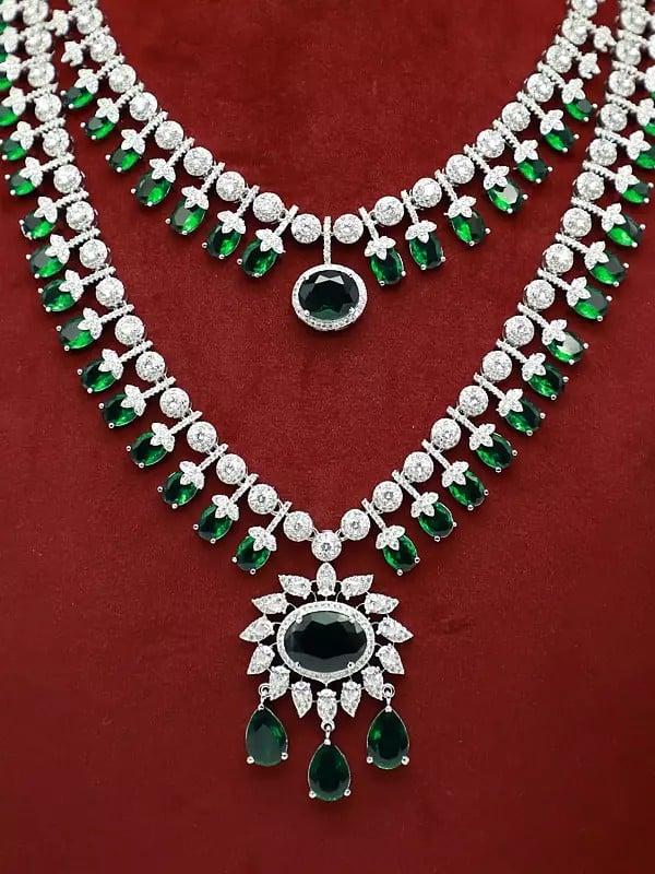 Exotic India Floral Design Exquisite Stone Studded American Diamond Double Layered Necklace Set With Earrings