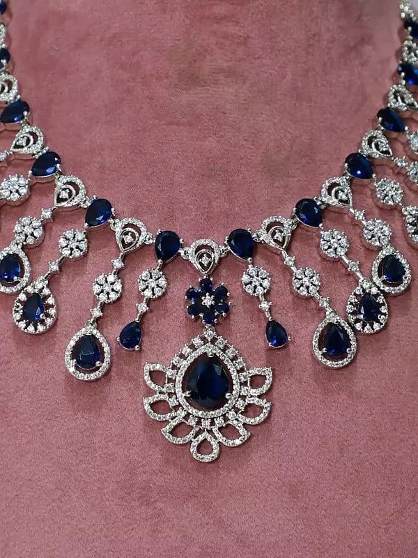 Exotic India Floral Design Stone Studded American Diamond Necklace Set With Earrings 
