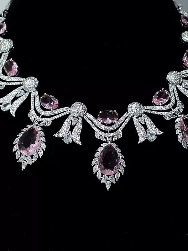 Exotic India Floral Design Stone Studded American Diamond Necklace Set With Earrings 