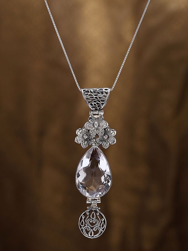 Exotic India Floral Sterling Silver Pendant With Teardrop Shaped Crystal 