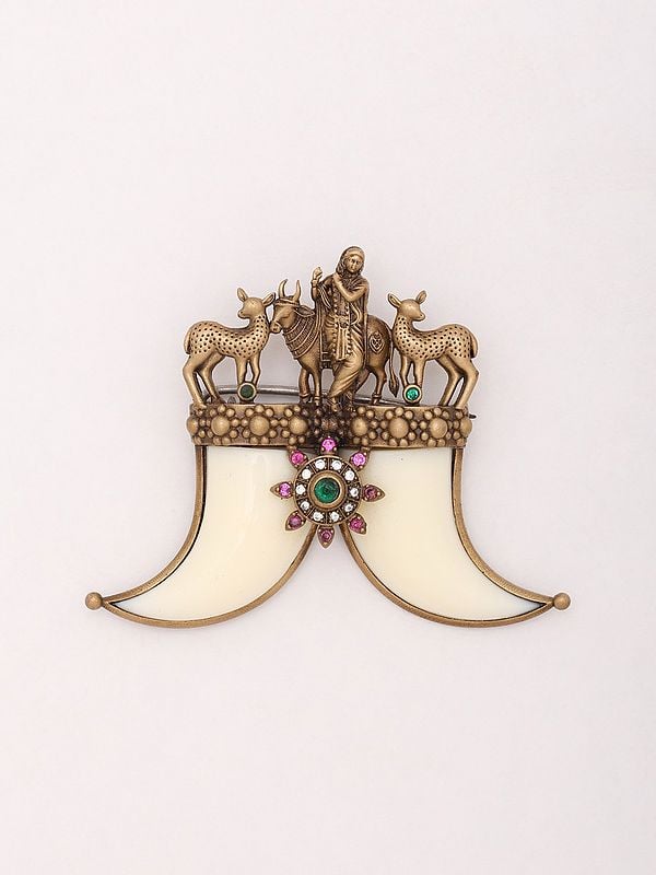 exotic india Fluting Krishna Brooch with Tiger Nail 