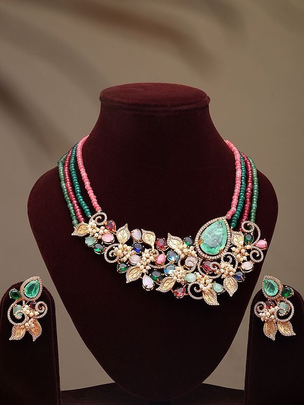 exotic india Four Strand Multi Stone Studded Floral Design Necklace and Earrings Set 