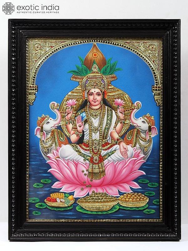 exotic india Gaja Lakshmi on Lotus - Embossed Tanjore Painting with Frame | Traditional Colors with Gold Work