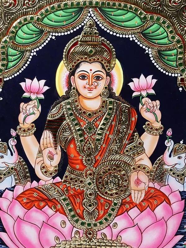 Exotic India Goddess Gajalakshmi Seated On Lotus | Framed Tanjore Painting | 24 Karat Gold Work