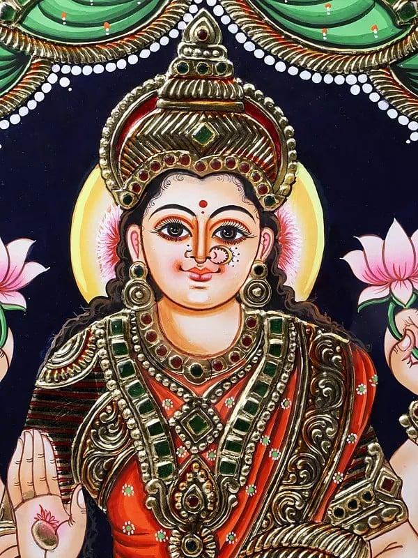 Exotic India Goddess Gajalakshmi Seated On Lotus | Framed Tanjore Painting | 24 Karat Gold Work