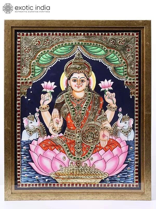 exotic india Goddess Gajalakshmi Seated on Lotus | Framed Tanjore Painting | 24 Karat Gold Work 
