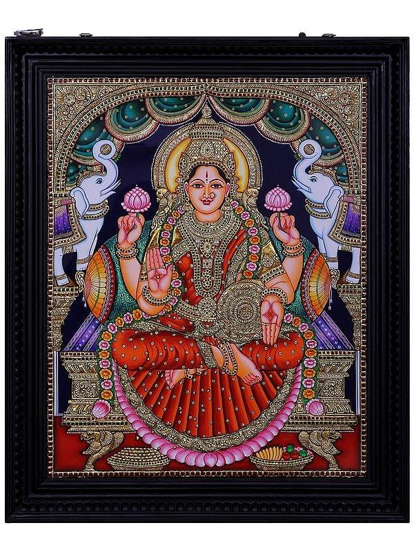 exotic india Goddess Gajalakshmi Tanjore Painting with Frame | Traditional Colors with 24 Karat Gold 