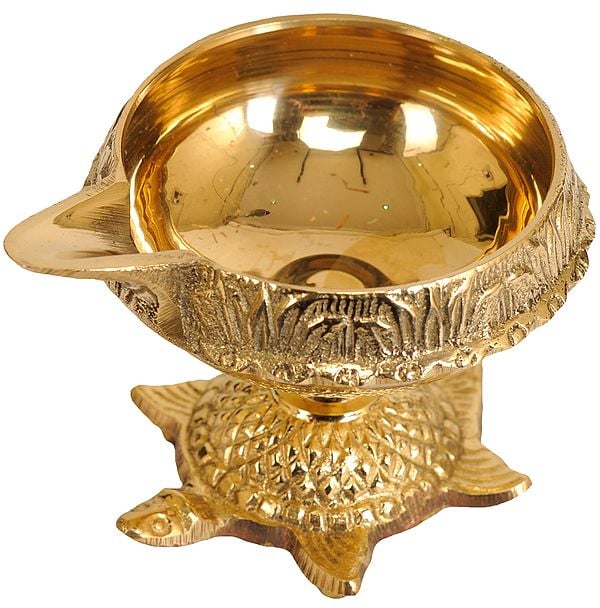 exotic india Handcrafted Brass Vastu Pooja Diya on Carving Tortoise 