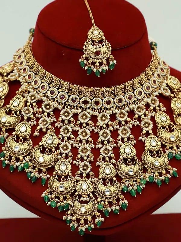 Exotic India Hanging Beads Necklace Set With Stunning Earrings And Mangtika