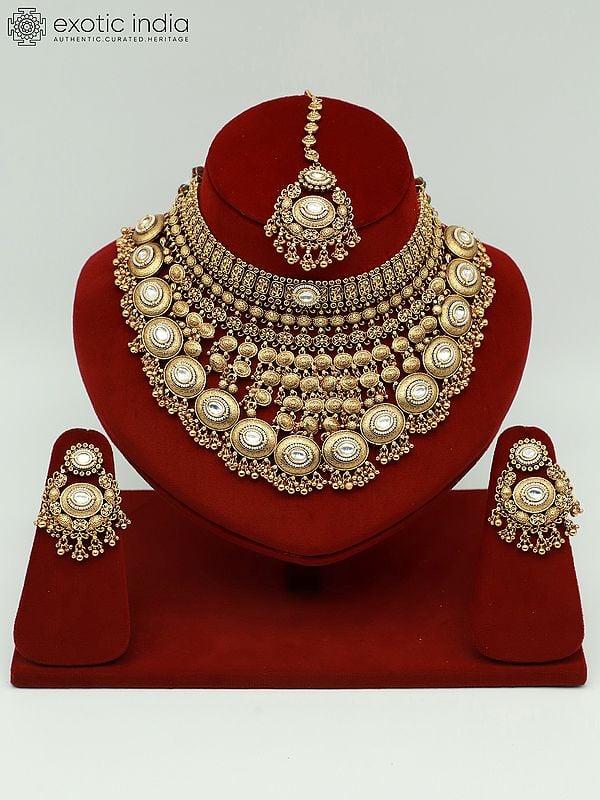 exotic india Heavy Brass Jewelry Set With Mangtika And Earrings For Bridal