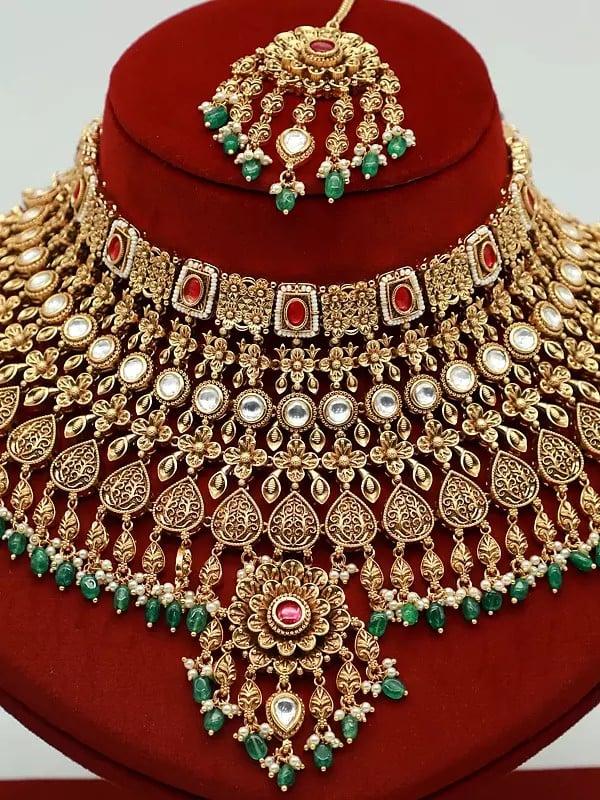 Exotic India Heavy Bridal Necklace Set In Brass With Earrings And Mangtika