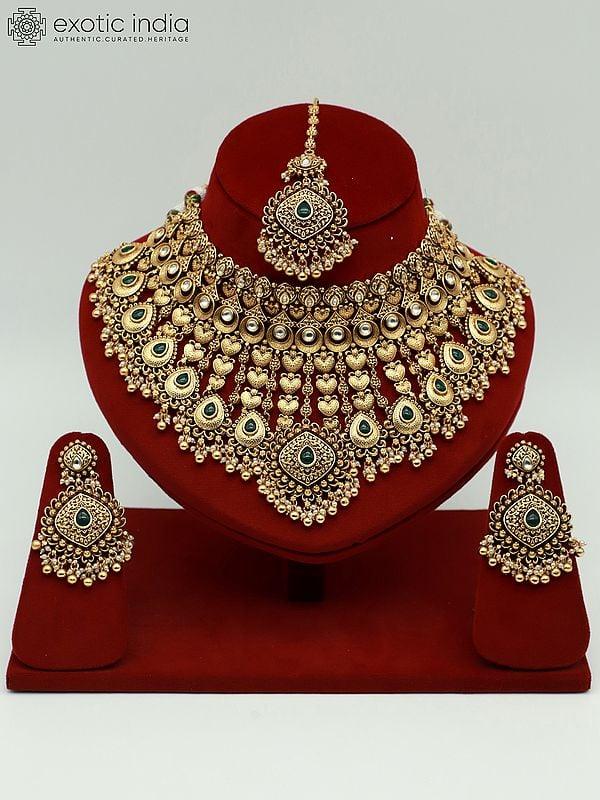 exotic india Heavy Bridal Necklace Set With Studded Kundan Mangtika And Attractive Earrings 