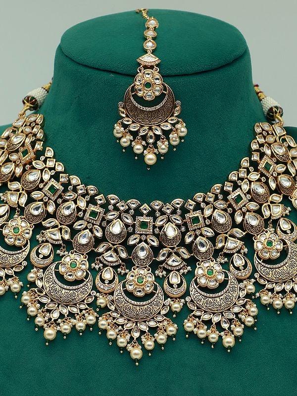 Exotic India Heavy Kundan Necklace Set With Mangtika And Dangling Pearl Earring