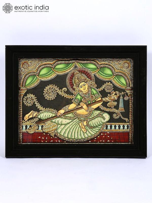 exotic india Indonesian Saraswati | 24 Karat Gold Work | Framed Tanjore Painting 