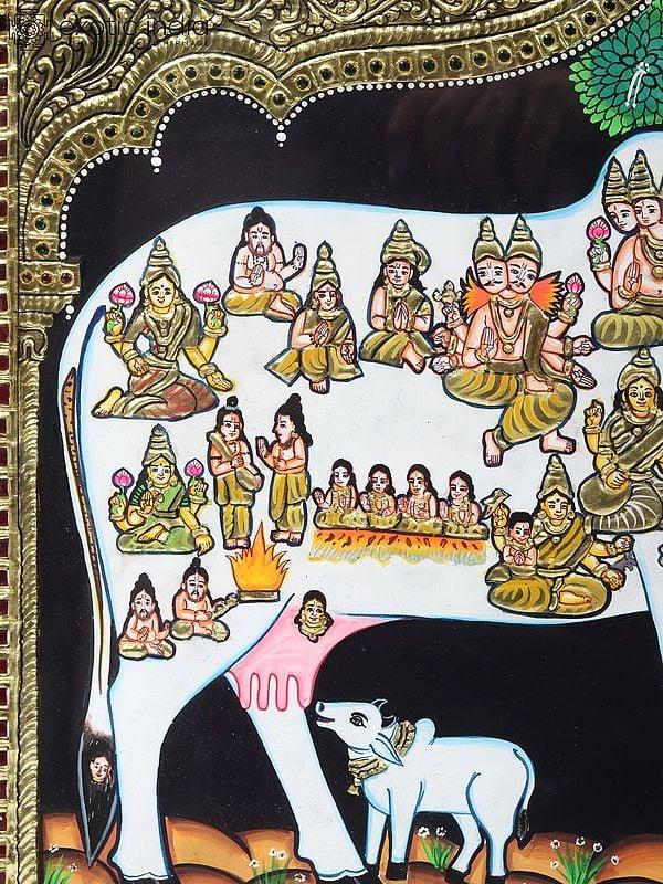 Exotic India Kasyapa Worshipping Kamdhenu Tanjore Painting | Traditional Colors With 24K Gold | Teakwood Frame | Gold & Wood | Handmade
