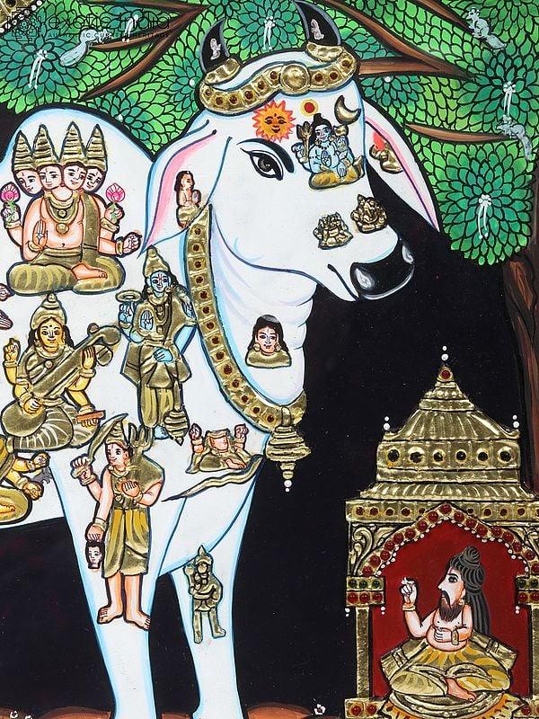 Exotic India Kasyapa Worshipping Kamdhenu Tanjore Painting | Traditional Colors With 24K Gold | Teakwood Frame | Gold & Wood | Handmade