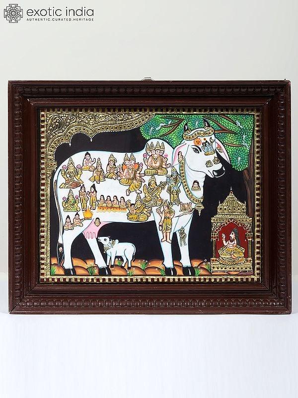 exotic india Kasyapa Worshipping Kamdhenu Tanjore Painting | Traditional Colors With 24K Gold | Teakwood Frame | Gold & Wood | Handmade 